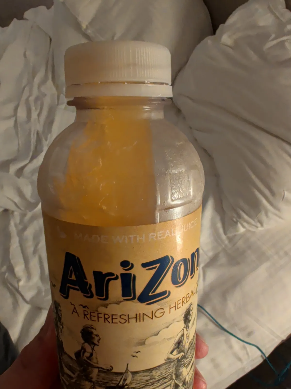 A frozen Arizona iced tea bottle